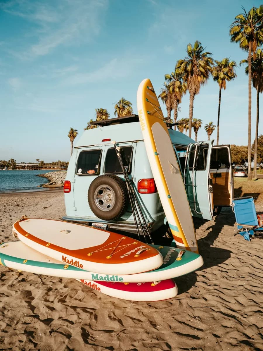 Van and surfboards at the beach